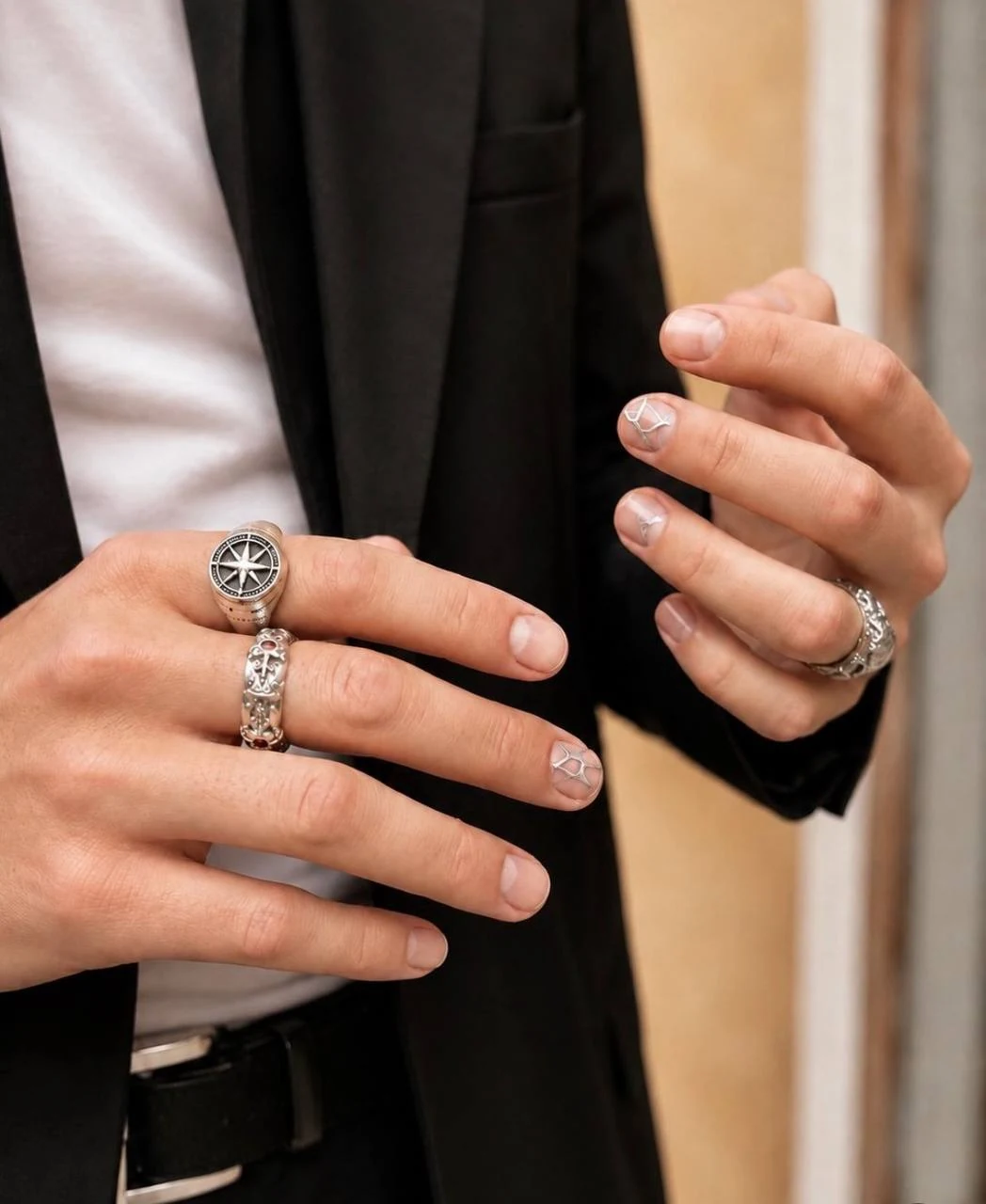 Men’s manicure with short natural nails and silver fine line nail design by Marzieh Nail Atelier